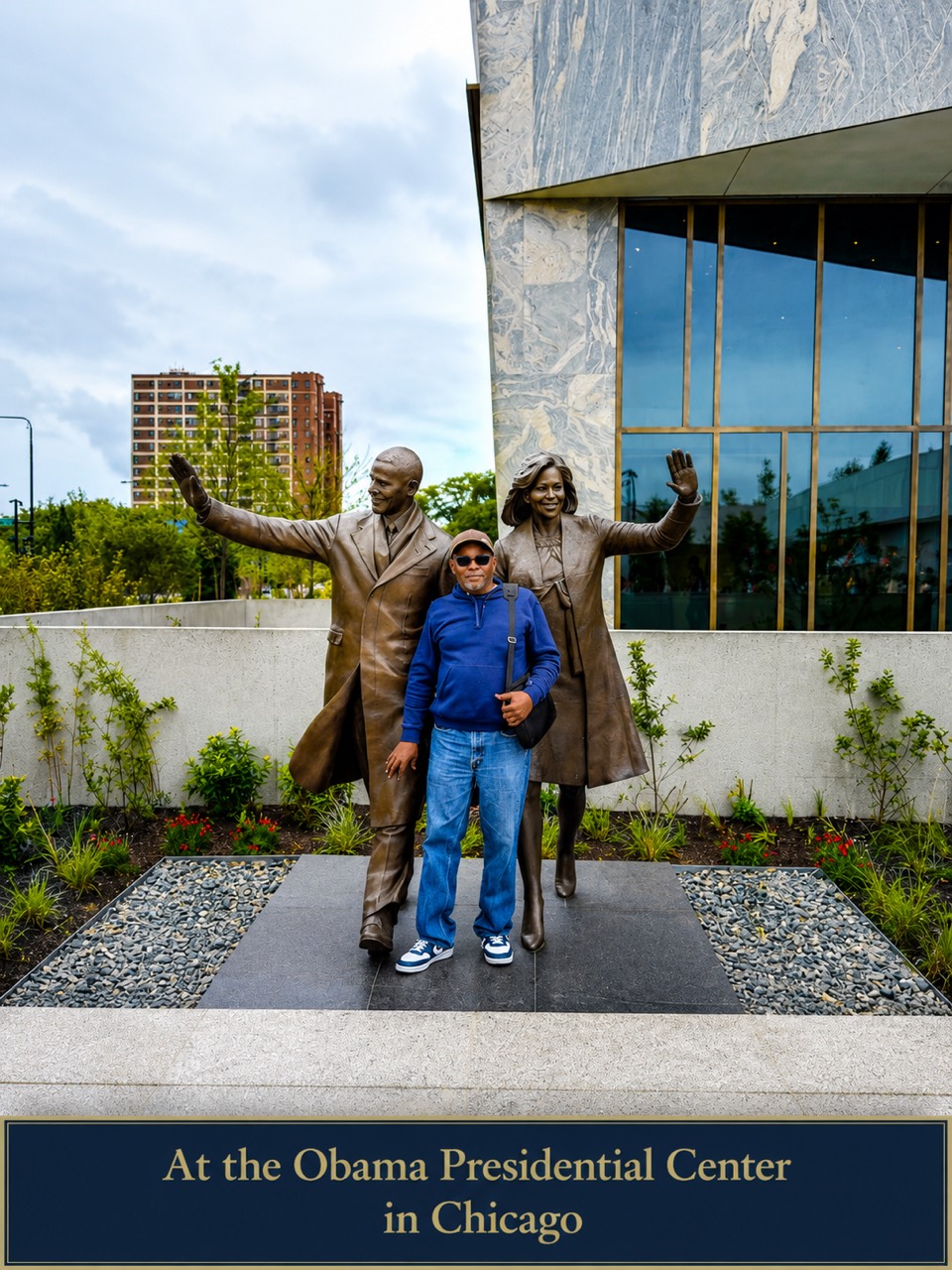 Dr. Stephens standing between statues of Barack and Michelle Obama at the Obama Presidential Center in Chicago